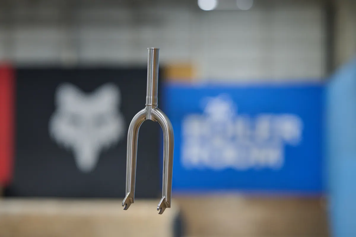 Close-up of XNXT performance components on an XKIDS race bike.